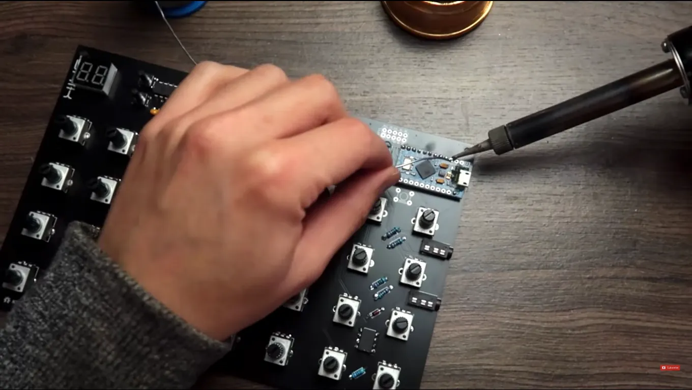 Hand soldering the SHIK N32B controller board.