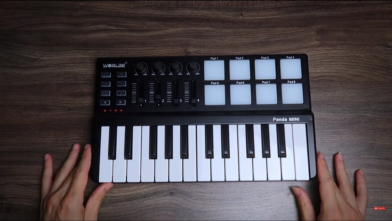 WORLDE Panda Mini MIDI keyboard with mini keys, pads, knobs and faders.
